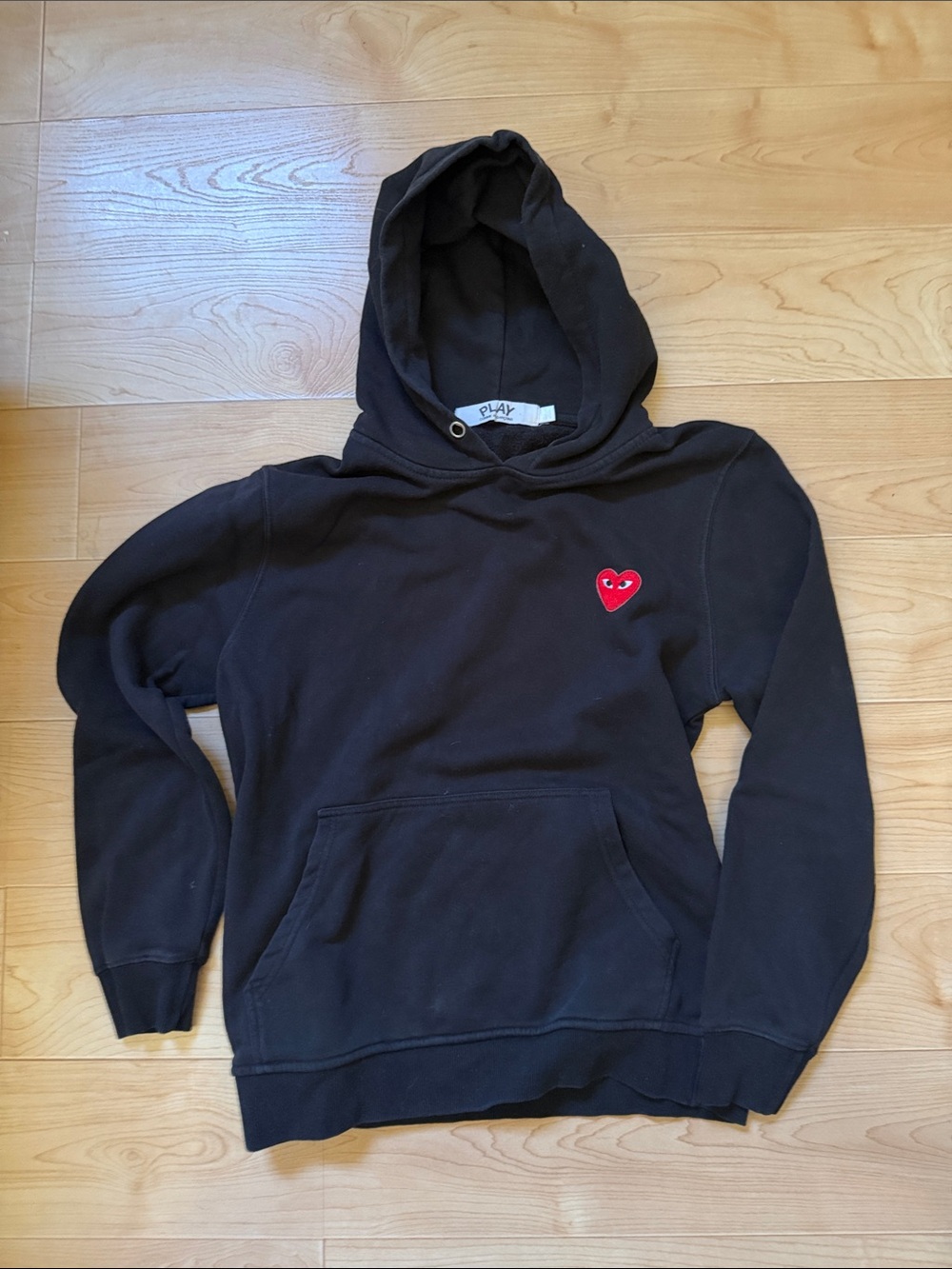 Comme des Garcons Black Hoodie with Red Heart Logo.